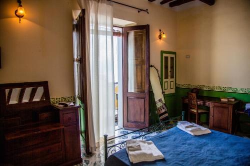 Postel nebo postele na pokoji v ubytování Hotel Arcangelo - Salina