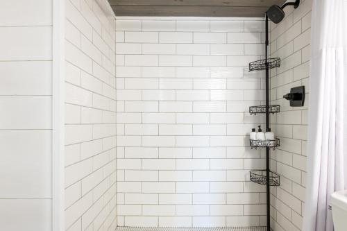 a bathroom with a shower with white subway tiles at Modern Mountain Escape in Gatlinburg