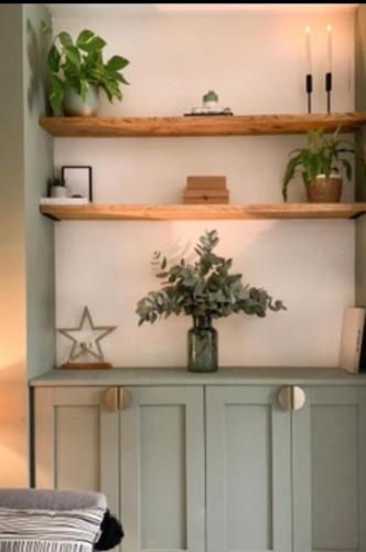 a table with a star and a plant on it at Sea Street House in Kent