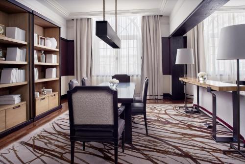 a dining room with a table and a desk at Four Seasons Hotel Mexico City in Mexico City