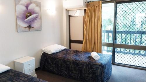 Ένα ή περισσότερα κρεβάτια σε δωμάτιο στο Miners Lodge Motor Inn