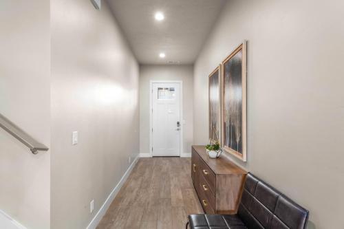 a hallway with a couch and a picture on the wall at Ocotillo Springs 67 Low Prices, Private Hot Tub, Pool, Basketball Arcade, Ping Pong and Community Pool in Santa Clara