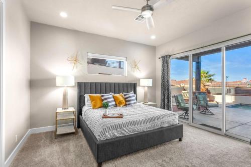 a bedroom with a bed and a large window at Ocotillo Springs 67 Low Prices, Private Hot Tub, Pool, Basketball Arcade, Ping Pong and Community Pool in Santa Clara