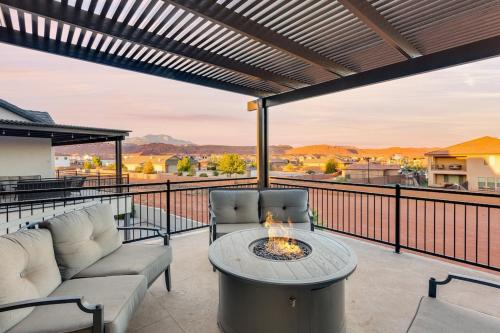 a patio with two chairs and a fire pit on a balcony at Ocotillo Springs 67 Low Prices, Private Hot Tub, Pool, Basketball Arcade, Ping Pong and Community Pool in Santa Clara