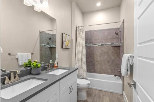 a bathroom with a sink and a toilet and a shower at Ocotillo Springs 67 Low Prices, Private Hot Tub, Pool, Basketball Arcade, Ping Pong and Community Pool in Santa Clara
