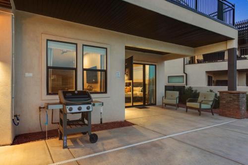 a patio with a grill in front of a house at Ocotillo Springs 67 Low Prices, Private Hot Tub, Pool, Basketball Arcade, Ping Pong and Community Pool in Santa Clara