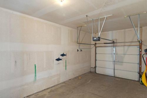 a garage with white walls and a glass door at Pet Friendly 2 King Beds Foosball Table in Rapid City