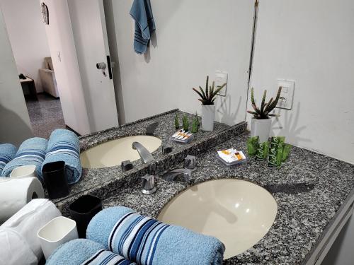 a bathroom counter with a sink and a mirror at Apto Beira Mar 2102 in Fortaleza