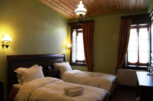 Cama o camas de una habitación en Nymfes Hotel