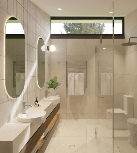 a bathroom with two sinks and a shower at The Lane Retreat in Pokolbin
