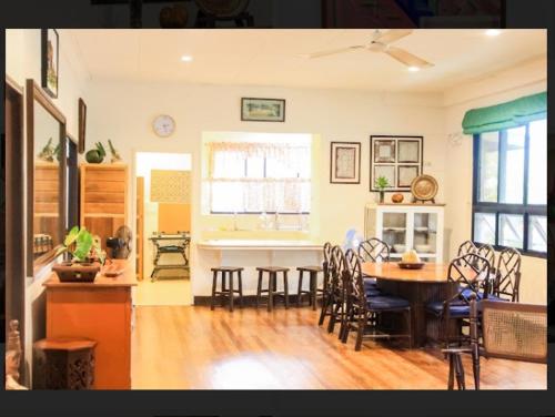 a kitchen and dining room with a table and chairs at Balay 8 Suites in Silay
