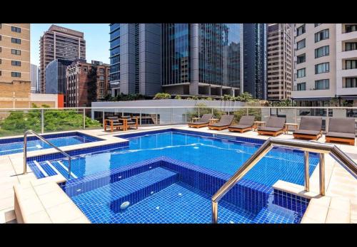 a large swimming pool on top of a building at S&P Apartments - Festival in Brisbane