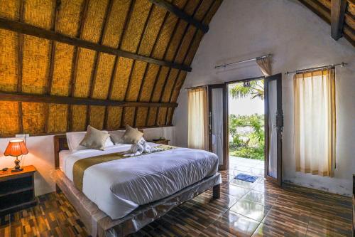 Postel nebo postele na pokoji v ubytování Diamond Beach Bungalow