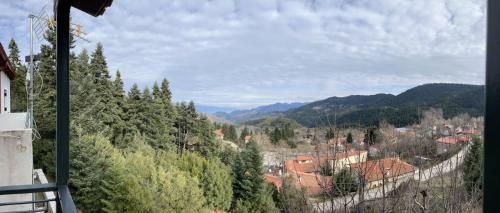 a view of a town in the mountains at Ελατόδασος in Pávliani