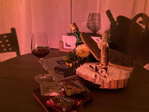 a table with a basket and a glass of wine at DDUBLE Square in Daegu