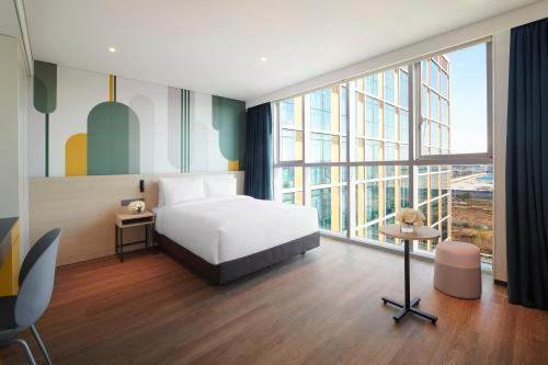 Кровать или кровати в номере ibis Styles Ambassador Incheon Airport T2