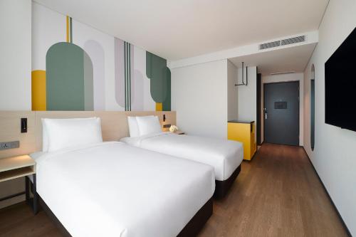 Кровать или кровати в номере ibis Styles Ambassador Incheon Airport T2