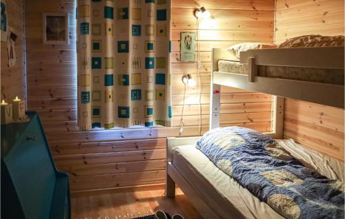 a bedroom with a bunk bed in a log cabin at Beautiful Home In Hebnes With Kitchen in Hebnes