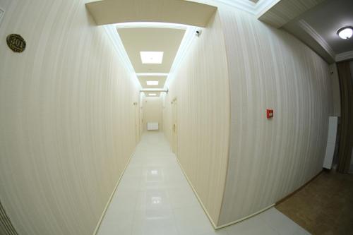 a hallway in a building with a ceiling at Armenia in Nerkʼin Giratʼagh