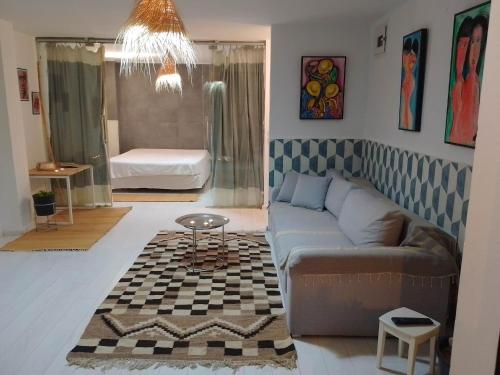 a living room with a couch and a table at SidiBou House in Sidi Bou Saïd