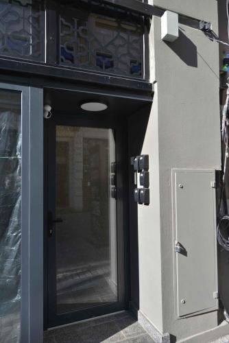 a black door on a building with a window at Otilia in Bucharest