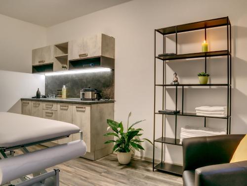 a kitchen with a table and a counter top at Penzion Krumlov - Massage studio in Český Krumlov