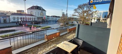 a balcony with a view of a city street at Leonardo Oranje Hotel Leeuwarden in Leeuwarden