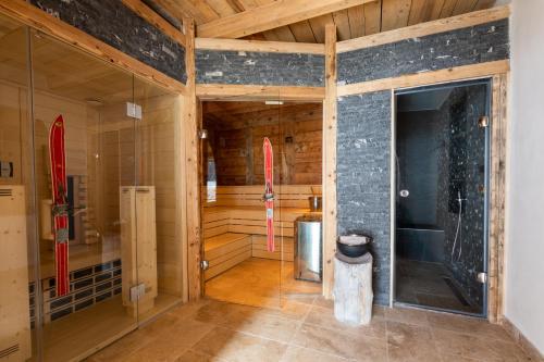 a room with a sauna with a surfboard in it at Monte Vita Tirol - Apartments in Biberwier