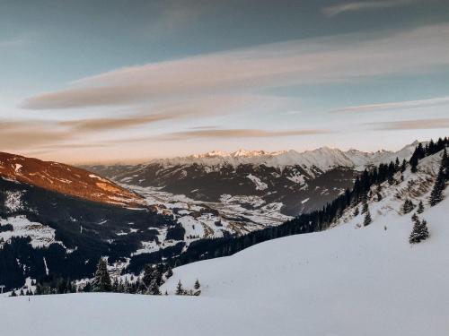 a view of a snow covered mountain with a valley at Berggasthaus & Lodge Resterhöhe in Mittersill