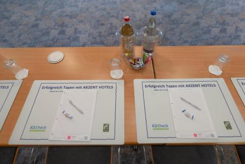 a table with two pages of a retrieval report andagent forms at AKZENT Hotel Aufkirchen in Aufkirchen