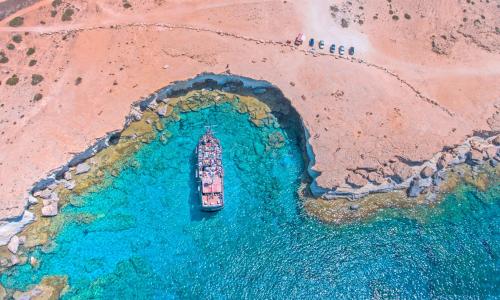 an aerial view of a boat in a body of water at Antigoni Hotel in Protaras