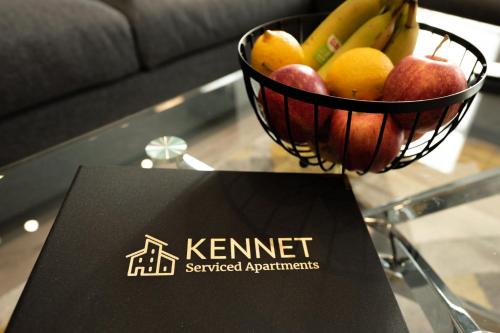 a basket of fruit on a table with a sign at Chester House in Reading