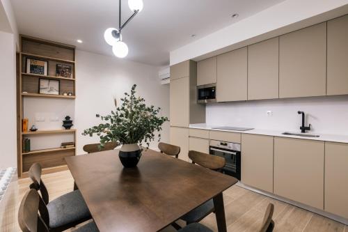 a kitchen with a dining room table and chairs at Luxury flat next to Gran Via Madrid in Madrid