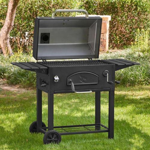 a bbq grill sitting in the grass at Econo Lodge Ardmore in Ardmore