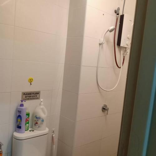 a small bathroom with a shower and a toilet at Jm in Shah Alam