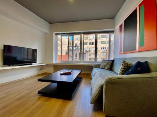 A television and/or entertainment centre at Mosaikon Guesthouses #Nikiou Str