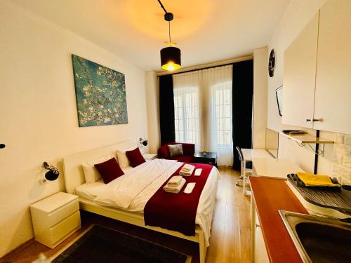 a bedroom with a bed and a desk in it at Aram Galata Suites in Istanbul