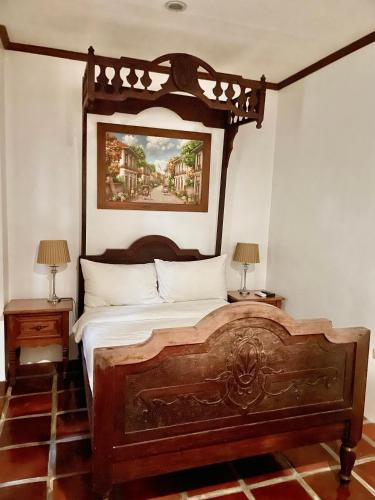 Una cama o camas en una habitación de Casa Simeon