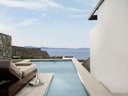 a swimming pool with a view of the ocean at Ezio Bo Luxury Living in Mýkonos City
