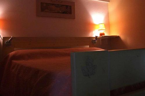 a bedroom with a bed with a lamp on it at Domus Sol Aria 2 in Castiadas