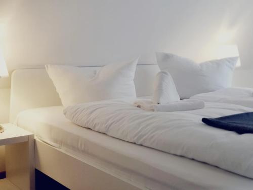 Ένα ή περισσότερα κρεβάτια σε δωμάτιο στο Lindenhof Apartments Bad Schandau