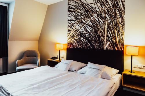 Posteľ alebo postele v izbe v ubytovaní Hotel & Restaurant Schröder