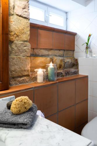 a kitchen with a counter with candles and a table at Romantische Ferienwohnung in Jugendstilvilla - Villa del Viento in Neustadt an der Weinstraße