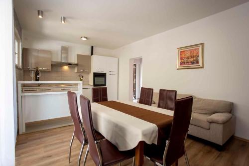 a room with a table and a couch and a kitchen at Apartment in Rovinj/Istrien 11487 in Štanga