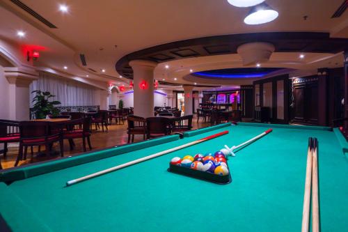 a pool table in a hotel room with a billiard at Ivy Cyrene Sharm Resort Adults Friendly Plus 13 in Sharm El Sheikh