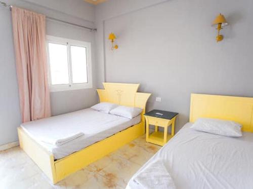 Llit o llits en una habitació de Palma Beach Camp