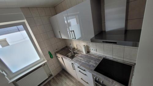 Dapur atau dapur kecil di Ferienwohnung Malbergblick klassifiziert mit 4 DTV-Sternen