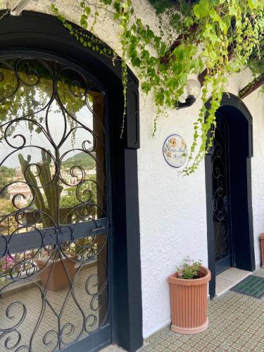 an entrance to a building with a black gate at Casa Malo' in Ischia