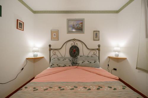 Ένα ή περισσότερα κρεβάτια σε δωμάτιο στο Casa Mamy a 150 metri dal mare