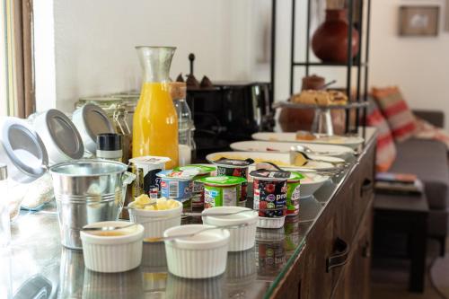 a counter top with food and drinks on it at Casa Solcor Boutique Bed & Breakfast in San Pedro de Atacama